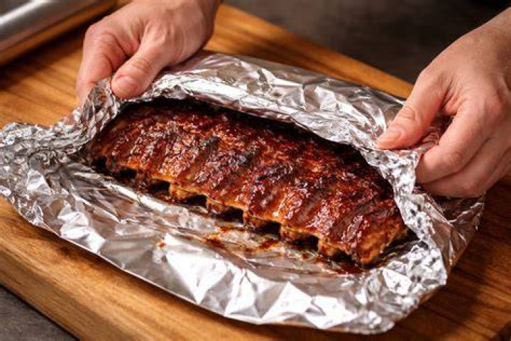 Do you wrap ribs in foil when smoking?
